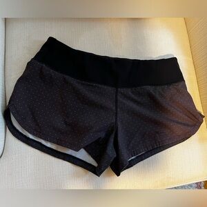 Vuori size small black polka dotted running shorts